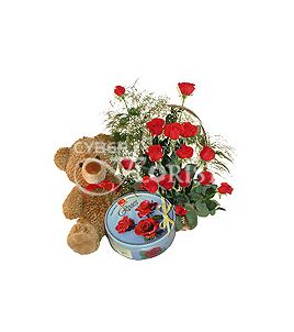 basket of red roses teddy bear and cookies